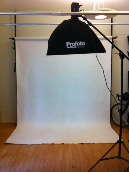 One Light Portrait in photo studio using a softbox on a boom stand.