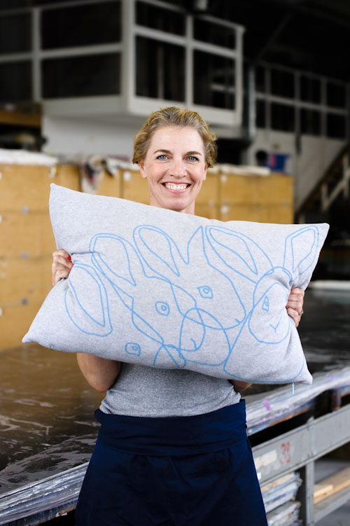 designer-holding-pillow