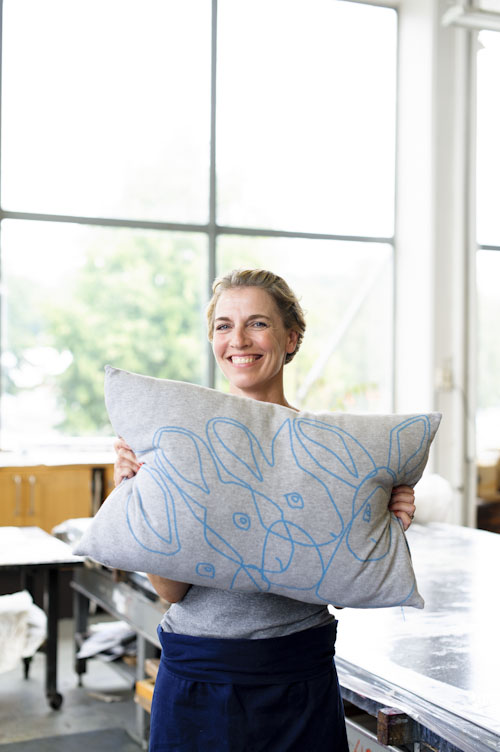 designer-with-large-windows-behind